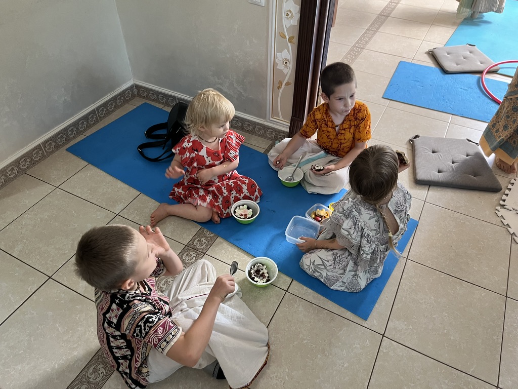 Children enjoying Prasadam